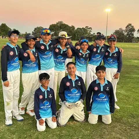 Darebin Chargers juniors in their club shirts at dusk